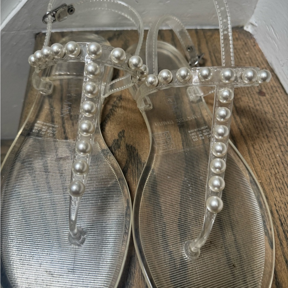 Stuart Weitzman Goldie Jelly Clear Sandals with Pearl Embellishments